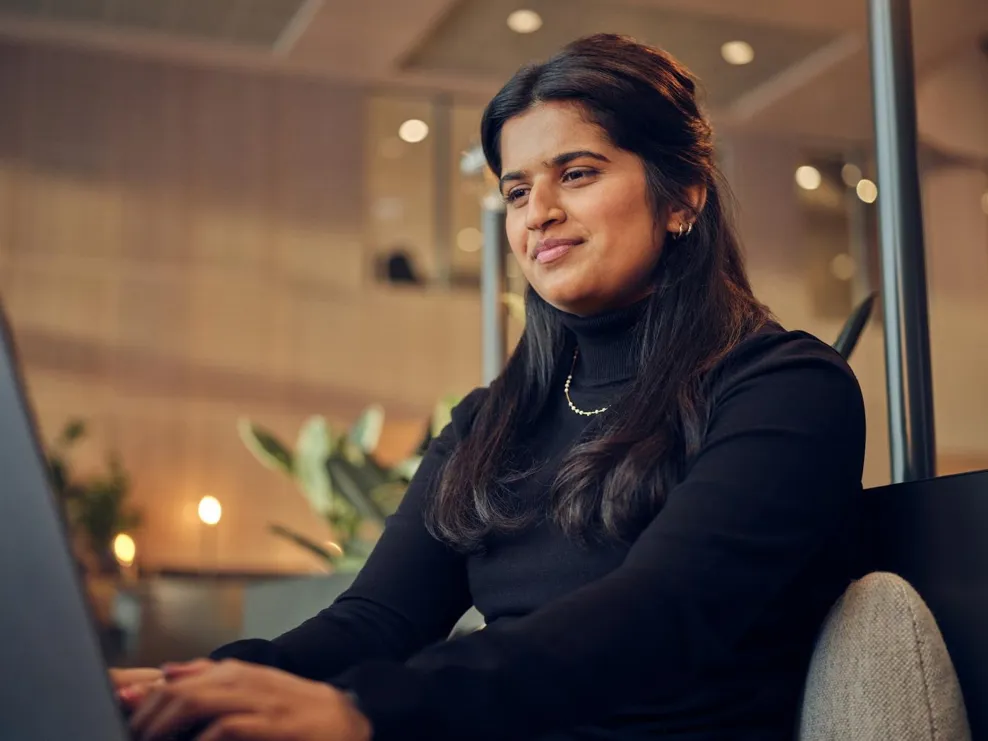 woman working on laptop smiling portrait